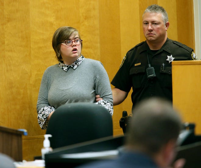 Morgan Geyser, one of two Wisconsin girls charged with stabbing a classmate to impress the fictitious horror character Slender Man, enters a Waukesha County Court for a status hearing Friday, Sept. 29, 2017, in Waukesha, Wis. Geyser will plead guilty in a deal that calls for her to avoid prison time and instead receive treatment for mental illness, attorneys announced Friday. (Michael Sear/Milwaukee Journal-Sentinel via AP, Pool)