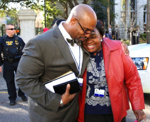 FILE - In this Jan. 11, 2017 file photo, the Rev. Eric Manning, pastor at Emanuel AME, leaves the Federal Court House after the death sentence hearing for Dylann Roof in Charleston, S.C.  Manning said on Sept. 28, race relations in the United States may be regressing, pointing to the white nationalist rally in Charlottesville, Virginia, in August. Manning said he hopes the country can use the same strength, resolve and faith that Charleston used after the church shooting to address racial inequality.(Leroy Burnell/The Post And Courier via AP)