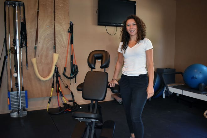 Kasey Morales, licensed massage body work therapist at Pisgah Physical Therapy, will offer donation-based chair massages on Oct. 13 to help family members and others affected by Hurricane Maria in Puerto Rico. [REBECCA WALTER/TIMES-NEWS]