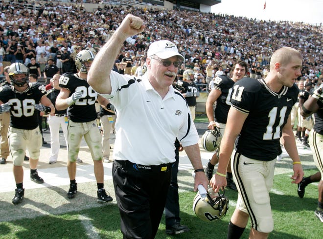 FILE - In this Sept. 29, 2007 file photo, Purdue coach Joe Tiller, celebrates a 33-19 football victory against Notre Dame in West Lafayette, Ind. Tiller, the winningest football coach in Purdue history, died Saturday, Sept. 30, 2017, in Buffalo, Wyo., the school said. He was 74.(AP Photo/Michael Conroy, file)