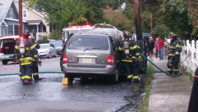 Firefighters respond to a minivan fire on Colbert Street in Stroudsburg Borough on Saturday, Sept. 30, 2017. [ASHLEY C. FONTONES/POCONO RECORD]