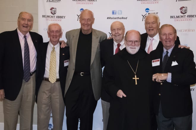 Belmont Abbey 1950s and 1960s basketball celebrate the induction of two of their players (Jim Mullen and Jim Lytle) and the jersey retirement of another (Danny Doyle). From left to right, Bill Ficke, Mullen, John Van Bargen, Hank Steincke, Abbot Placid, Doyle and Lytle [Photo by Africa H. Schaumann/Belmont Abbey College]