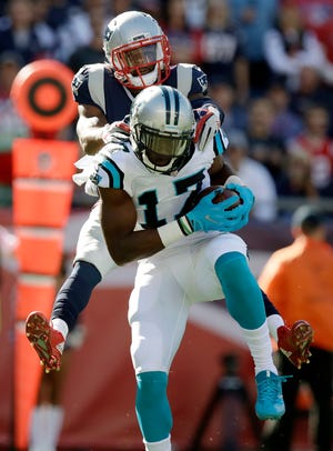 Panthers wide receiver Devin Funchess, front, catches a touchdown as Patriots cornerback Malcolm Butler defends during the second half of the Panthers 33-30 win over the Patriots on Sunday. [AP Photo/Charles Krupa]