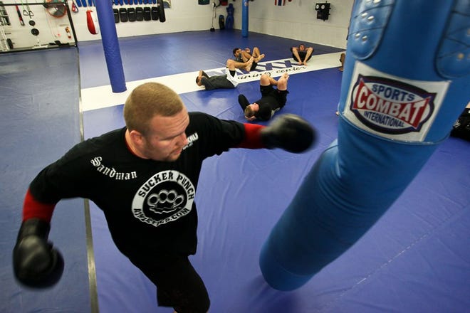 MMA heavyweight division fighter Lee Beane practices his punches at the Maxx Training Center. August 26, 2010. Stoughton, MA.