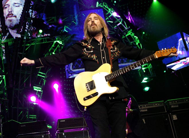 FILE - In this June 17, 2008 file photo, Tom Petty performs with The Heartbreakers at Madison Square Garden in New York. Petty has died at age 66. Spokeswoman Carla Sacks says Petty died Monday night, Oct. 2, 2017, at UCLA Medical Center in Los Angeles after he suffered cardiac arrest. (AP Photo/Jason DeCrow, File)