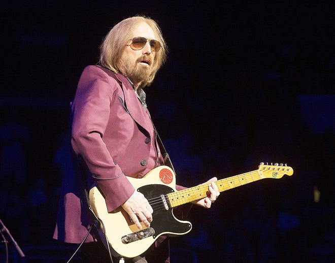 In this July 1 file photo, Tom Petty of Tom Petty and the Heartbreakers performs during their "40th Anniversary Tour" in Philadelphia. Petty has died at age 66. Spokeswoman Carla Sacks says Petty died Monday night at UCLA Medical Center in Los Angeles after he suffered cardiac arrest. [OWEN SWEENEY/INVISION/ASSOCIATED PRESS]