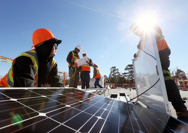 Solar panels are installed on a rooftop. [Tuscaloosa News, File]