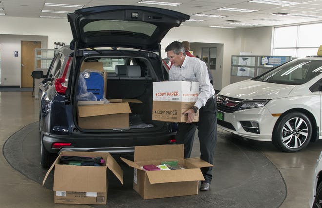 CHIEFTAIN PHOTO/JOHN JAAQUES Vidmar Honda dealer Derek Vidmar on Tuesday loads boxes filled with backpacks and other school supplies that Puebloans donated to help schoolchildren in the Houston area following Hurricane Harvey. The Rocky Mountain Region Honda Dealers Association is shipping more than 2,500 backpacks to the storm-ravaged area. which he is sending to Texas flood victims from Pueblo Colo. on Oct.17, 2017. (John Jaques,The Pueblo Chieftain)