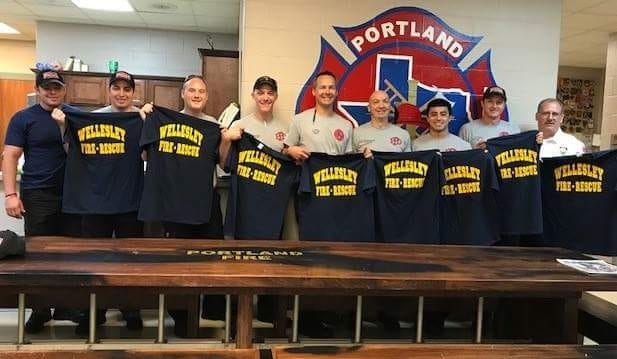 The Portland, Texas, firefighters show off their Wellesley shirts. [Courtesy photo]