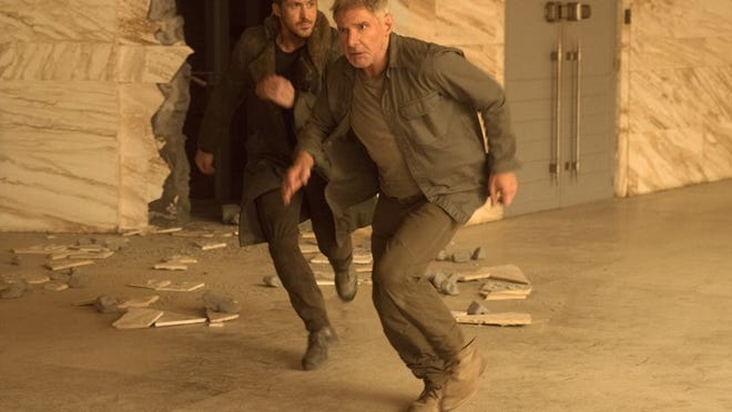Ryan Gosling, left,and Harrison Ford star in “Blade Runner 2049.” Contributed by Stephen Vaughan