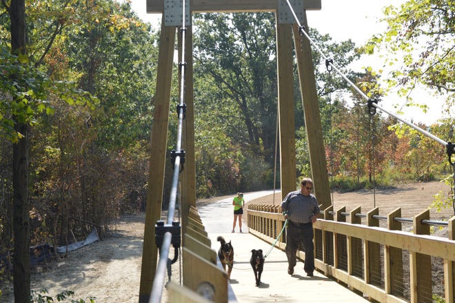 The new suspension bridge at the Grand Ravines Park in Jenison opened to the public on Sept. 15, 2017. [Jake Allen/Sentinel]