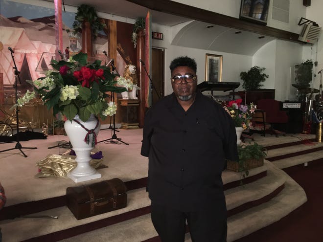 Rev. Melvin Brown, the pastor at Kingdom Authority International Ministries, 518 N. Court St., stands in the church sanctuary on Wednesday, Oct. 4, 2017. He said he doesn't yet know if they will appeal a state Appellate Court ruling in a lawsuit involving a fatal police shooting. [KRISTEN ZAMBO/RRSTAR.COM STAFF]