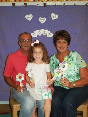Students at Immaculate Conception Elementary recently celebrated Grandparent Day. Pictured: Aria with grandparents Mike and Lori Smith. PHOTO PROVIDED