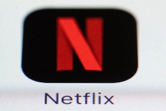This Monday, July 17, 2017, photo shows the Netflix logo on an iPhone. On Thursday, Oct. 5, 2017, Netflix announced it is raising the price for its most popular U.S. video streaming plan by 10 percent in a move that may boost its profits, but slow the subscriber growth that drives its stock price. (AP Photo/Matt Rourke)