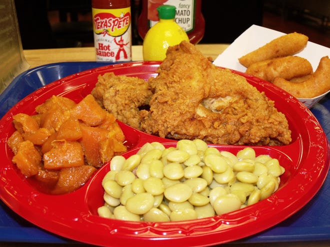 The lunch special at Kinlaw's Welcome Grill includes a choice of meat, bread, two sides and a drink for $7. Shown is Southern fried chicken, yams, lima beans and hush puppies. [Alison Minard for The Fayetteville Observer]