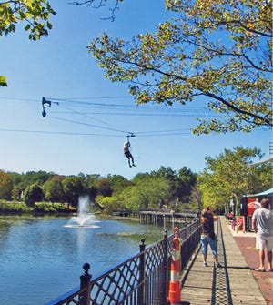Don Farrand, age 87, recently went zip-lining across the Kalamazoo River in Allegan. The tower is 60 feet high and the distance is 600 feet across the river. He climbed an additional 30 feet and zip-lined back. Don is a resident of Coldwater. COURTESY PHOTOS