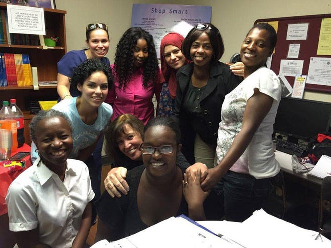 Instructors, volunteers and members of an Expanded Horizons GED Mathematical Reasoning class at the Women’s Center of Jacksonville pose for a group photo. Class members said the center’s literacy classes feel like family. “They cheer us on to do our best,” said one woman. (Provided by the Women’s Center of Jacksonville)