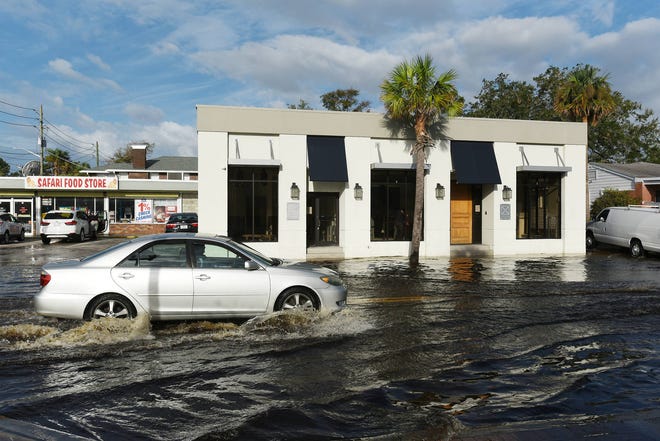 After the weekend’s rains and high tide Monday morning, localized flooding surrounded businesses along San Marco Boulevard as many are still cleaning up after the floodwaters from Hurricane Irma. (Bob Self/Florida Times-Union)
