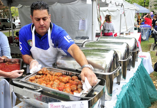 Brian Torello, owner of the Gas Lamp Grille, prepares meatballs during last year’s Festa Italiana ‘Festival in the Park’ held at Touro Park in Newport. This year’s festival at Touro will take place today.