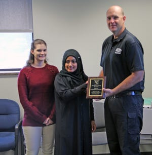 Coldwater Assistant Public Safety Director Joe Scheid awards Maryam Aljabaly and Abby Licht, Coldwater High School students in the Youth Engaged in Prevention members, with the Pehrson Award for their work in drug abuse prevention.



CHRISTY HART-HARRIS PHOTO