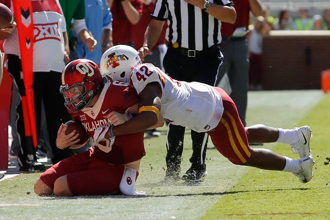 Iowa State's Marcel Spears Jr. brings down Baker Mayfield in the Cyclones' upset victory last Saturday. (Photo by Bryan Terry)