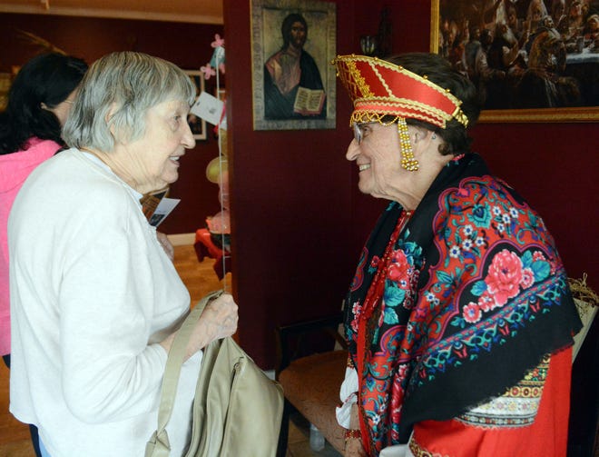 Liselotte Irby of Norwich, left, talks with Anna Krempl of Norwich Saturday at the 20th annual Russian Festival at the Holy Martyrs and Confessors of Russia Church in Norwich. See videos and more photos at NorwichBulletin.com [John Shishmanian/ NorwichBulletin.com]