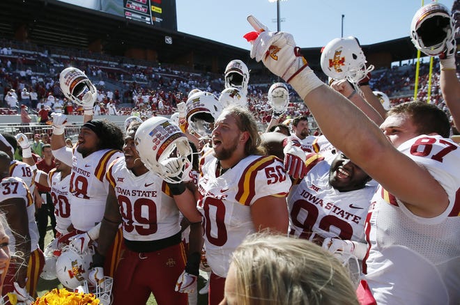 Iowa State players celebrate after the Cyclones defeated No. 3 Oklahoma 38-31 on Saturday in Norman, Okla. [Sue Ogrocki/The Associated Press]