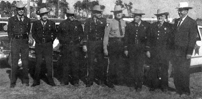 Former Lake County Sheriff Willis McCall, far right, is pictured in an old newspaper photo with uniformed deputies, from left, Malcom McCall, Bill Brooks, Douglass Sewell. N. E. Griffin Jr., Lucious Clark, Clarence Jones and Leroy Campbell. [Submitted]