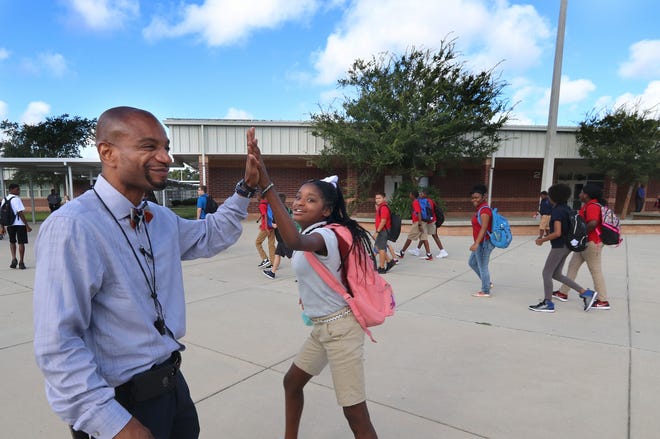 Campbell Middle School Principal Jerry Picott interacts with students as they change classes Wednesday morning, Aug. 23, 2017. [News-Journal/Jim Tiller]