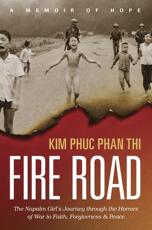 This cover image released by Tyndale Momentum shows, "Fire Road: The Napalm Girl´s Journey through the Horrors of War to Faith, Forgiveness, and Peace," by Kim Phuc Phan Thi. (Tyndale Momentum via AP)