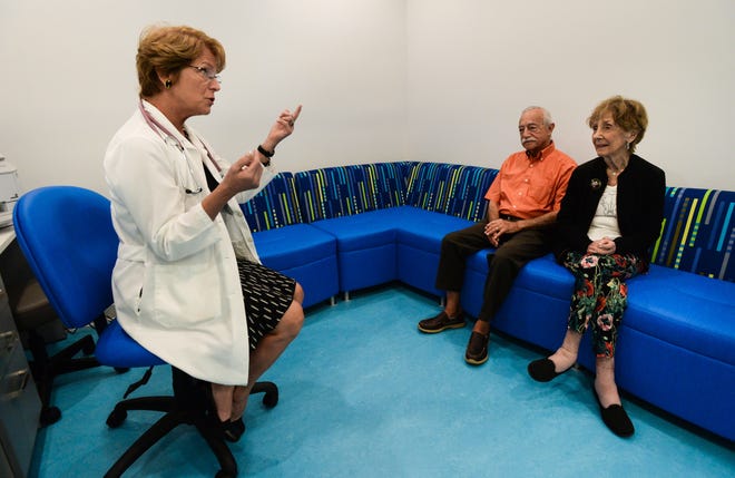 Physician Nema Runyan has an initial consultation with Howard and Iris Koota at the new EliteHealth Medical Center in Sarasota. [STAFF PHOTO/DAN WAGNER]