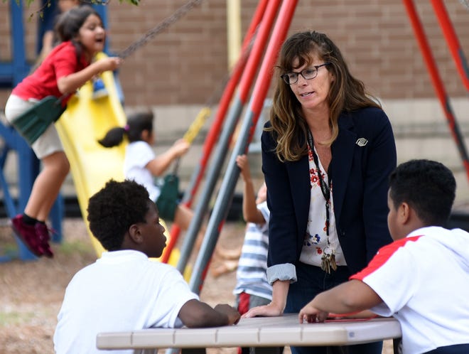 Angie Hill talks with kids at the Brigade Boys & Girls Club at the club in Wilmington, N.C., Monday, September 25, 2017. Hill has worked at the club for eight years and has recently been promoted to Operations Director for the three county network of the Brigade Boys & Girls Club.  [Matt Born/StarNews Photo]
