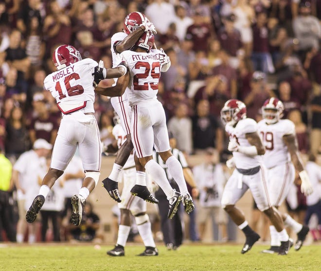 Alabama defensive back Laurence "Hootie" Jones (6), defensive back Minkah Fitzpatrick (29) and linebacker Jamey Mosley (16) celebrate during the second half of the Texas A&M-Alabama game on Saturday, Oct. 7, 2017, in College Station, Texas. The Crimson Tide won, 27-19. [Photo/Laura Chramer]