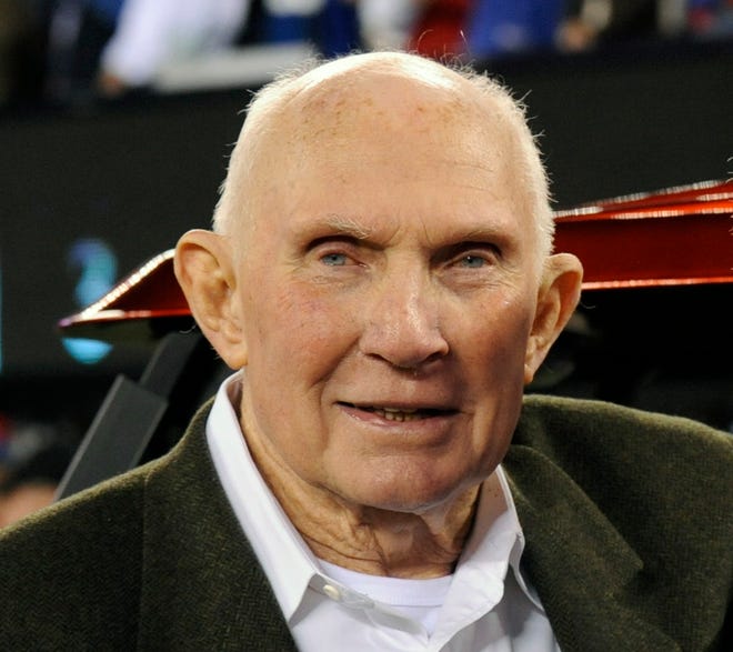 FILE - In this Oct. 3, 2010, file photo, Y. A. Tittle poses before an NFL football game between the Chicago Bears and the New York Giants in East Rutherford, N.J. Tittle, the Hall of Fame quarterback and 1963 NFL Most Valuable Player, has died. He was 90. His family confirmed to LSU, where Tittle starred in college, that he passed away. No details were immediately provided. (AP Photo/Bill Kostroun, File)