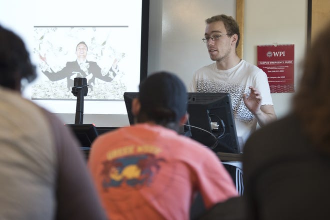 Sophomore Calvin Kocienda presents his character's development during "Writing Characters for Interactive Media & Games" class recently at Worcester Polytechnic Institute. [T&G Staff/Christine Hochkeppel]