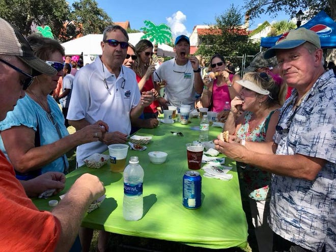 Mike House/For Bluffton Today Attendees enjoy plenty of shrimp at the festival Saturday in Beaufort.