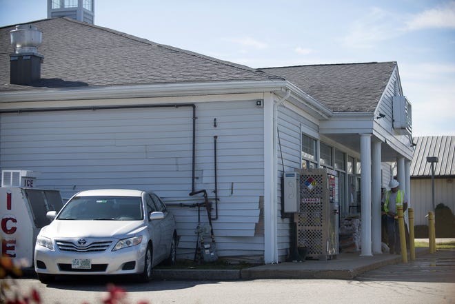 A motorist backed into Mr. Mike's in Dover causing damage to a gas line and the building including a storage room inside. [John Huff/Fosters.com]
