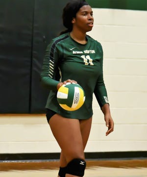 Ayden-Grifton's Zion Hardy prepares to serve during the Chargers' straight set victory over North Lenoir Tuesday. [Photo by William Hardy / Special to The Free Press]