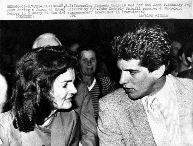 Jacqueline Kenndy Onassis and her son John F. Kennedy Jr. chat during a forum at Brown University, June 4, 1983, two days before his graduation from Brown. / UPI photo.