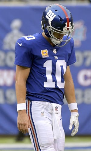 Eli Manning and the Giants are 0-5 despite high expectations. A slew of injuries mean the Giants are unlikely to get better, which could lead to changes in the offseason. [AP Photo/Bill Kostroun]