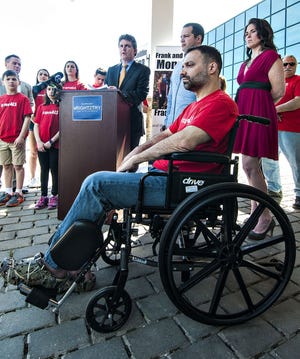 In this 2016 file photo, Frank Mongiello, front, of Lower Makefield listens as former U.S. Rep. Mike Fitzpatrick, R-8, addresses constituents during a rally supporting the Right to Try Act — legislation that would give people suffering from diseases like ALS the ability to try medications and therapies not yet approved by the Federal Drug Administration. Mongiello suffers from ALS. [File]