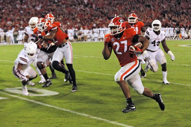 Georgia running back Nick Chubb breaks away to score a touchdown against Mississippi State during the second half on Saturday, Sept. 23, 2017 in Athens. (Bob Andres/Atlanta Journal Constitution via AP)