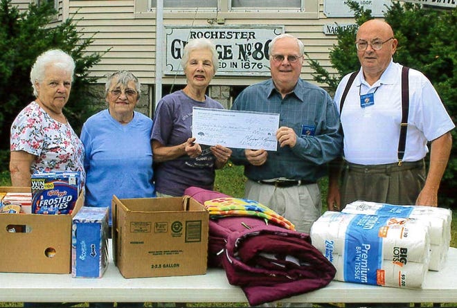 Rochester Grange #86 held its 7th annual Jumpstart for the Homeless Shelter on Saturday, Sept. 16. Thomas M. McNamara Jr. and Roger Mayford of the Knights of Columbus gave Grange members Lois Enman, Sandy Binnette, Annette Lemieux and Jim Jacobs a check for the shelter. The Grange would like to thank all those who donate. [Courtesy photo]