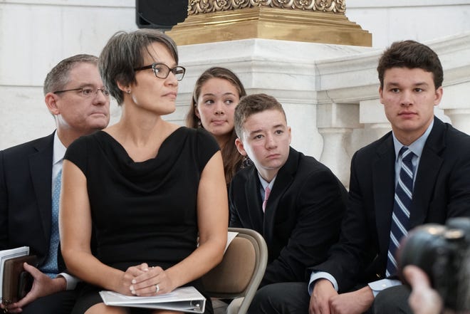 Melissa Long, second from left, is accompanied by her husband, James E. Long, daughter Haley Long, and sons Coleman and Noah Long at the swearing-in ceremony. [The Providence Journal/Sandor Bodo]