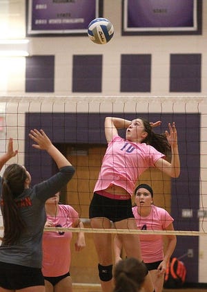 Hadley Miller of Three Rivers rises up for a kill attempt against Allegan on Thursday evening.