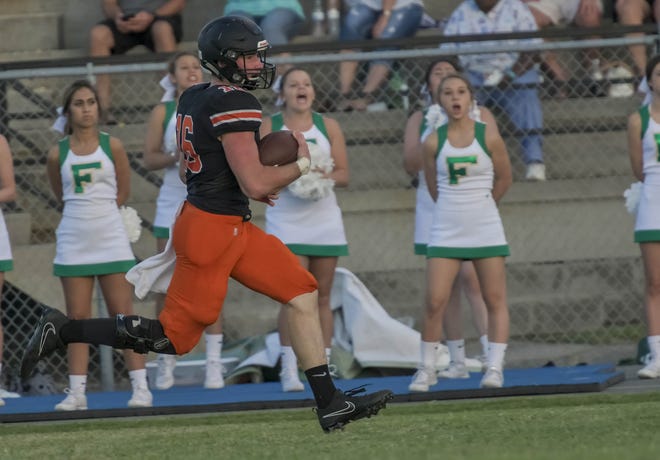 Leesburg's Wyatt Rector (16) runs with the ball during a win over Ocala Forest High School on Sept. 22 in Leesburg. [PAUL RYAN / CORRESPONDENT]