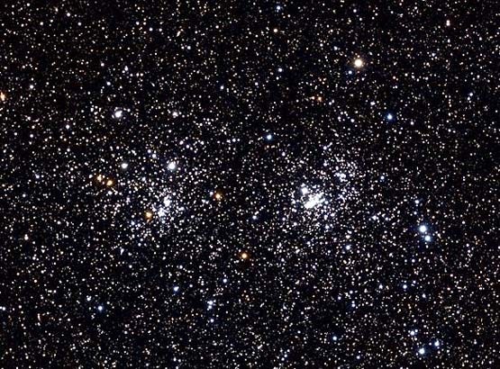 The Double Cluster in Perseus, NGC 884 (left) and NGC 869 (right), as seen in a small telescope at low power.

Genuson/Wikimedia Commons