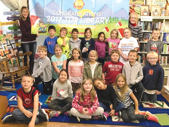 Mrs. Metrish’s second grade class from Pickford Public Schools visited the Pickford Community Library on Friday to celebrate their “Top Library” status. Pictured with the students and holding the banner are Jessie Metrish (far left) and Ann Marie Smith, Pickford Community Library Manager (far right). “Mrs. Metrish has been the Pickford Public Schools contact and has partnered with the Pickford Community Library on the program for four years now,” said Smith. “We are so proud of our all of our participants. What an incredible honor for our community!” The library is located at 230 E. Main Street in Pickford.