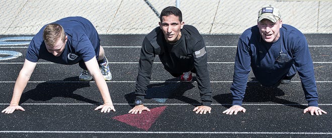 CHIEFTAIN PHOTO/FILE Physical agility and strength is now at the forefront of the Pueblo Police Academy training program. Recruits (above, left to right) Sam Hock, Isaac Abila and Clay Klipfel do pushups during their time at the academy.