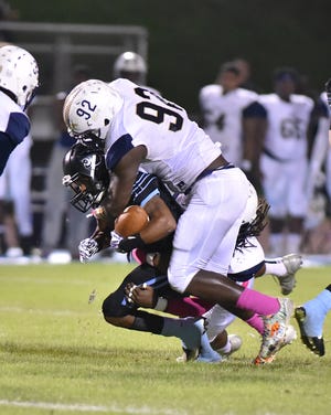 Paul W. Bryant's Landen Perry (92) makes the tackle during Friday night's game against Northridge. [Photo/Patrick Jacks]